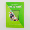 A picture of the front cover of the book "How To Go Waste Free", showing a picture of a bin cut diagonally in half, half of which is full and half of which is empty.