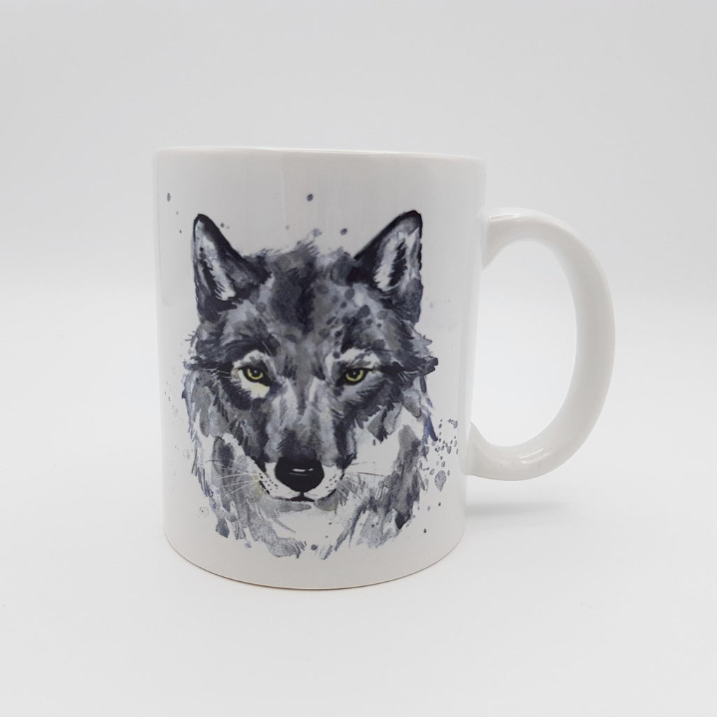 A white ceramic mug with a grey wolf watercolour design.