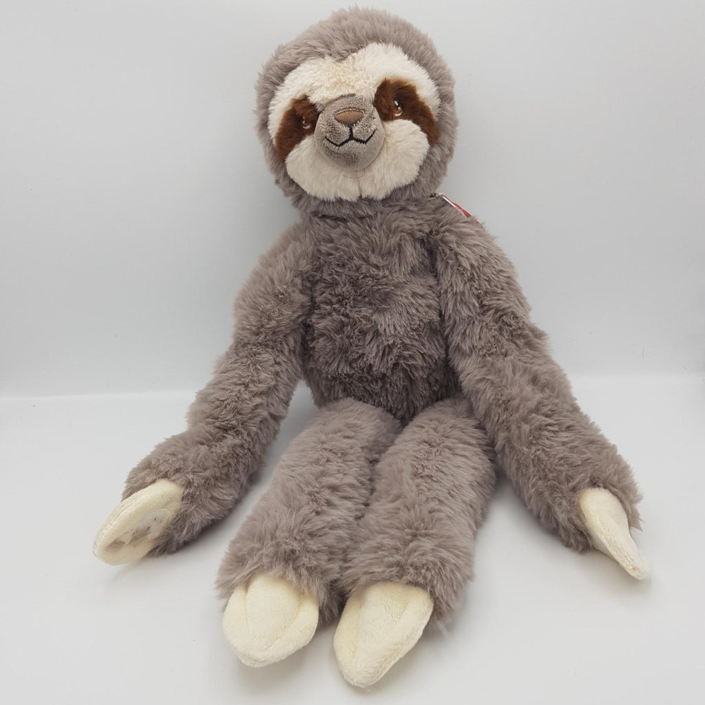 A smaller grey and white sloth eco soft toy, with brown eyes and velcro hands