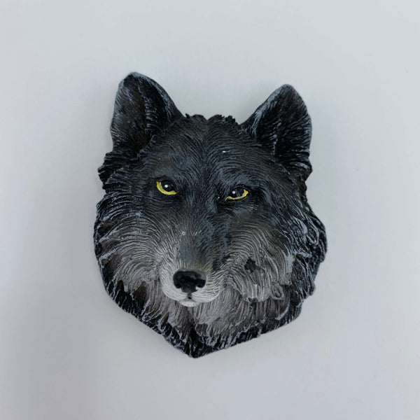 A wolf head fridge magnet