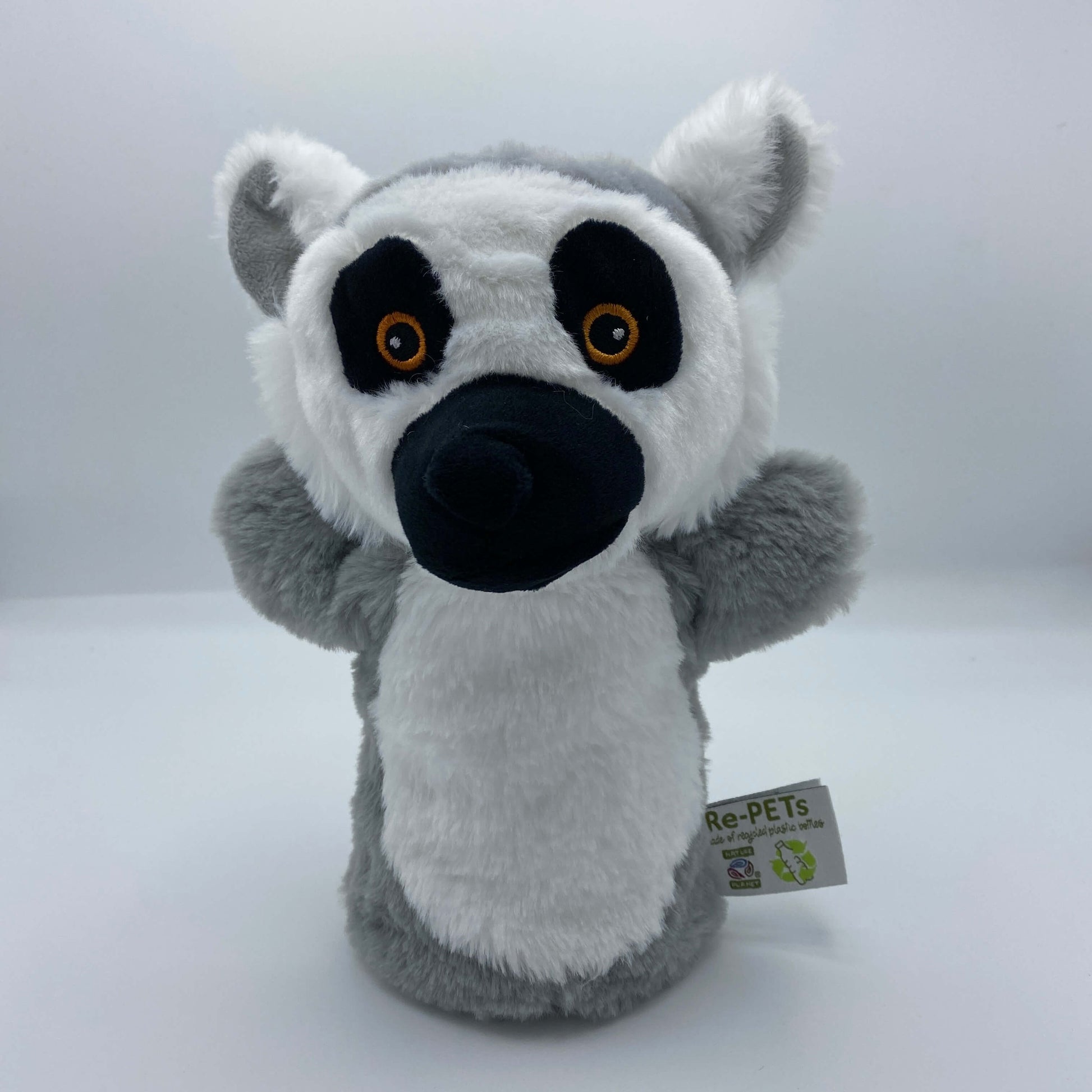 A white and grey ring tailed lemur hand puppet, with black eye markings and nose