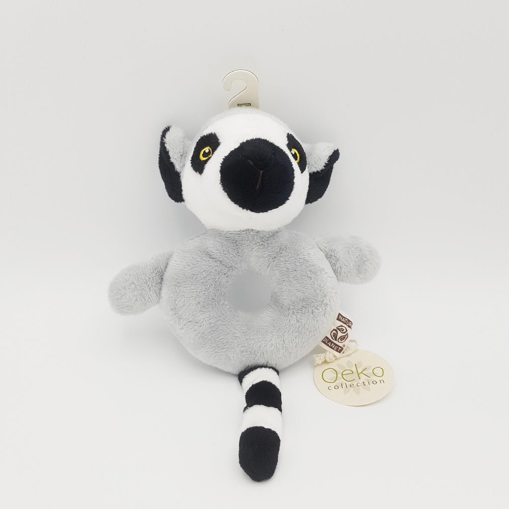 Soft toy ring-tailed lemur rattle with hole in the middle, a lemur's head at the top, tail at the bottom and grey fur.